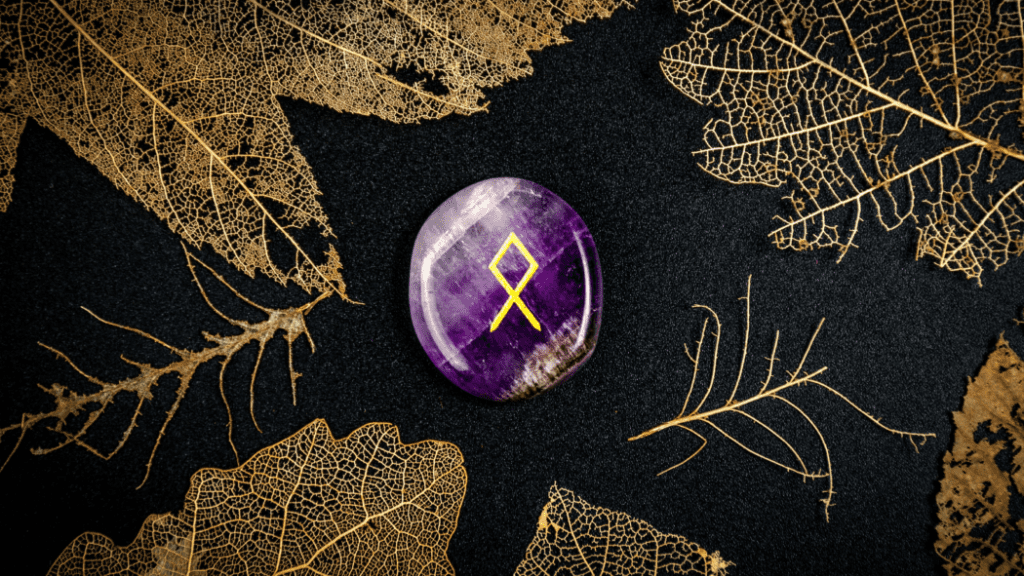 polished rune amid leaves