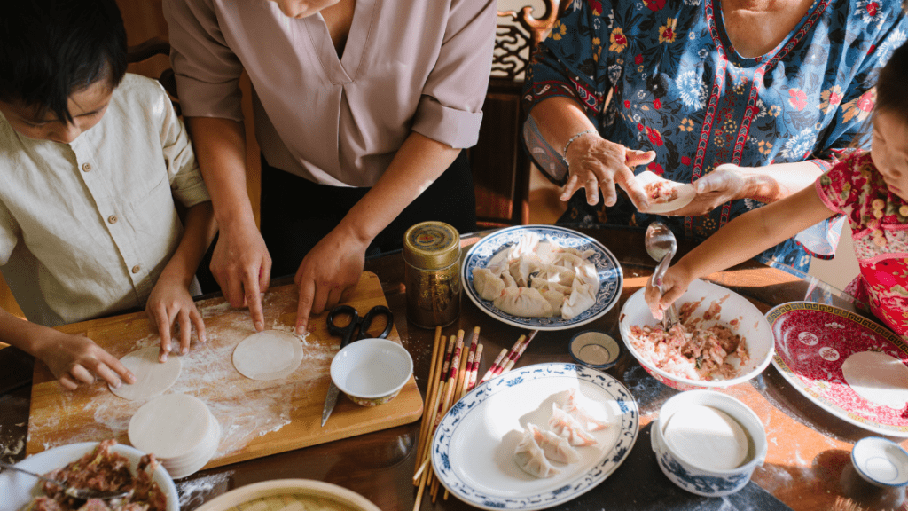 intergenerational members of a family making dumplings