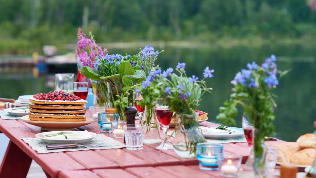picnic table set with forget-me-nots and other flowers