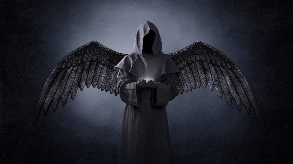 hooded dark angel holding a light in hands