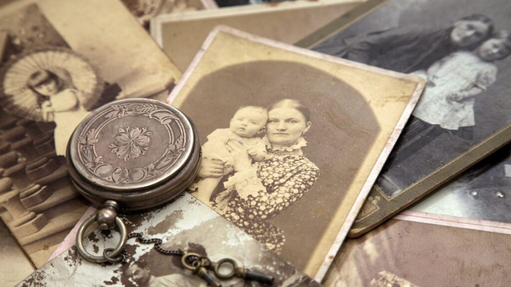 Grouping of vintage photographs and keepsakes.