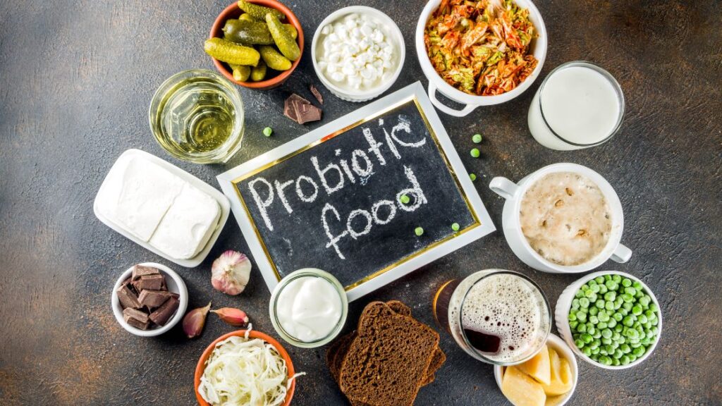 A grouping of fermented food with a blackboard highlighting probiotic food.