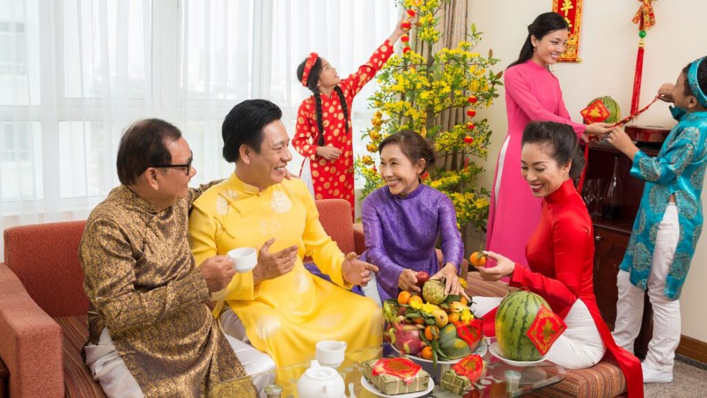 Asian family enjoying a celebration in traditional clothing. 