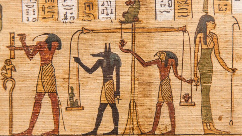 egyption artwork featuring Anubis the jackal-headed god
