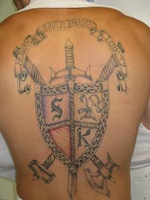 family crest tattoo example on a man's back