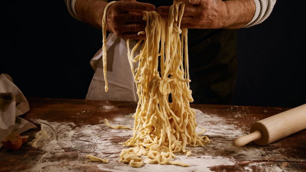 cook making homemade heiroom recipe pasta from scratch