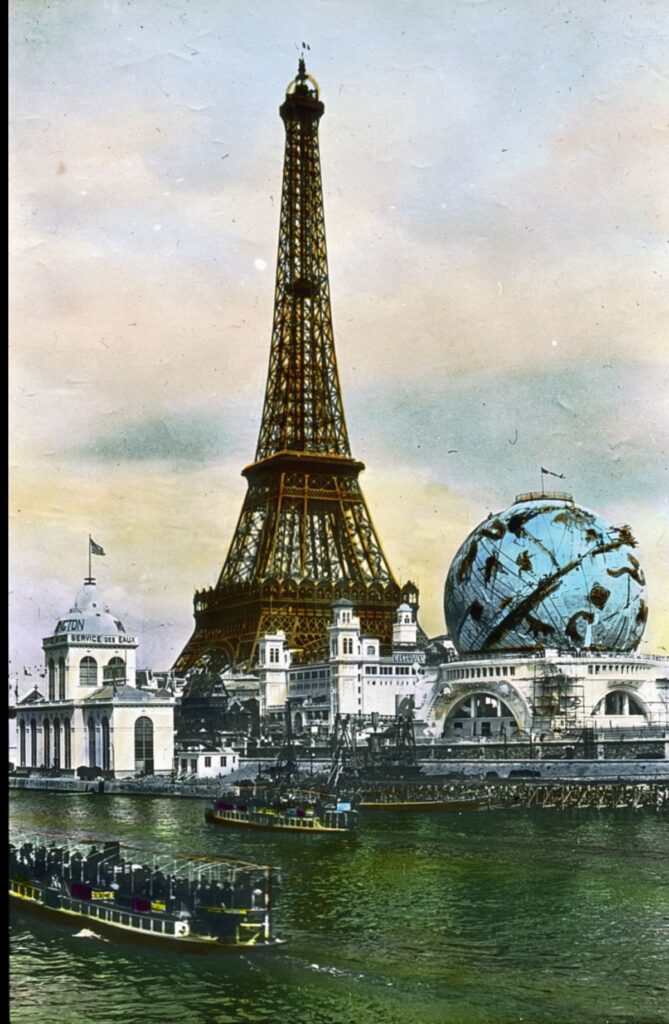 vintage cultural symbol of the Eiffel Tower in Paris during the World's Fair with the Celestial Globe, river and river transports