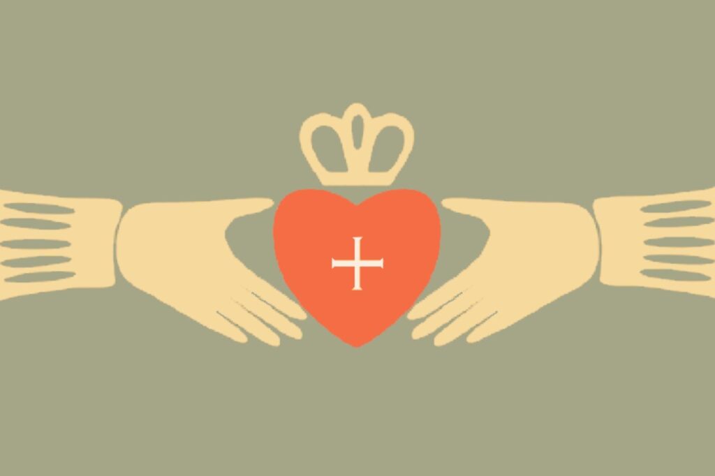 two hands holding a heart with a cross and a crown